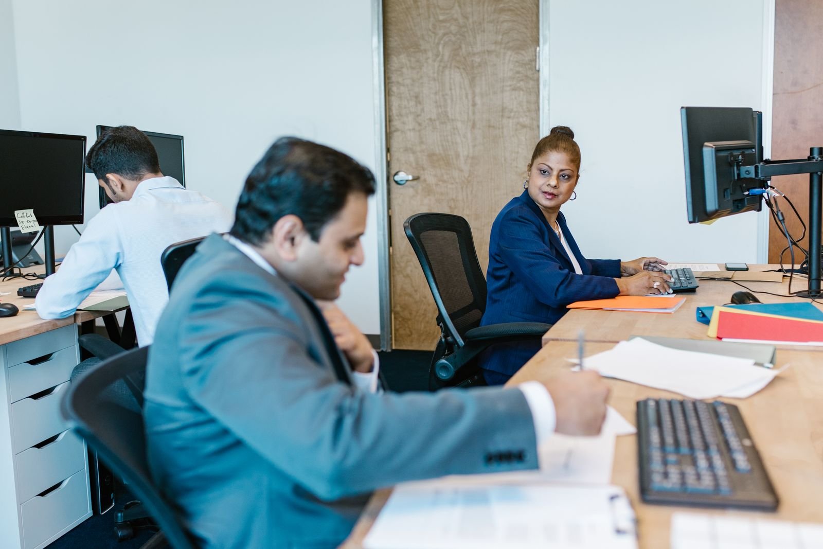 Famlinx team members collaborating on a client solution
